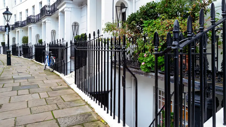 Georgian townhouse terrace with tall sash windows, the period stock whose window positions set bathroom layouts in Exeter