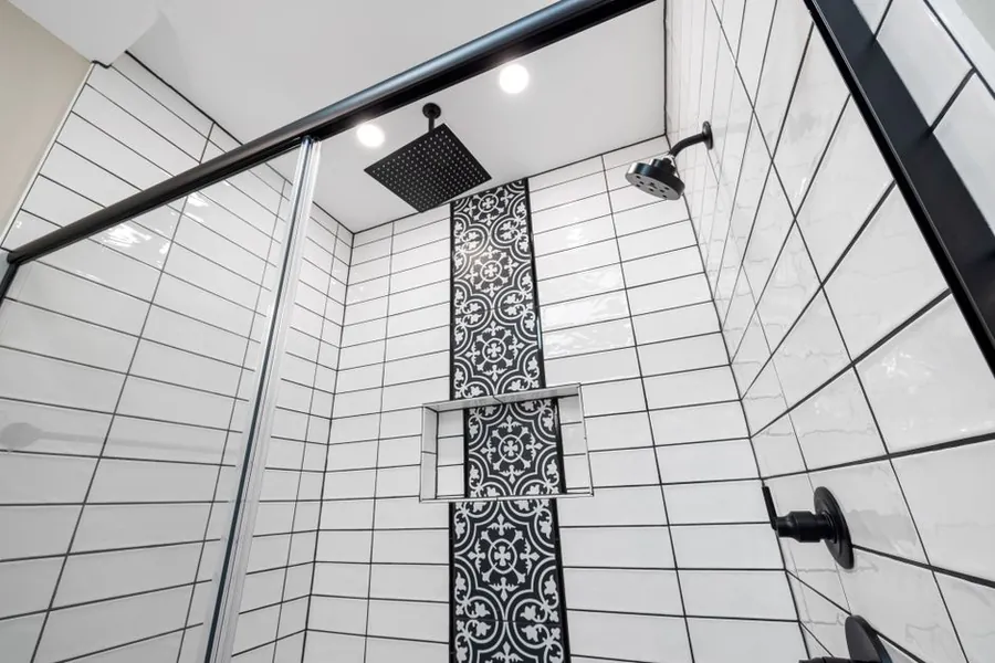 A tiled shower enclosure showing the ceiling and wall detailing a steam room in Exeter needs
