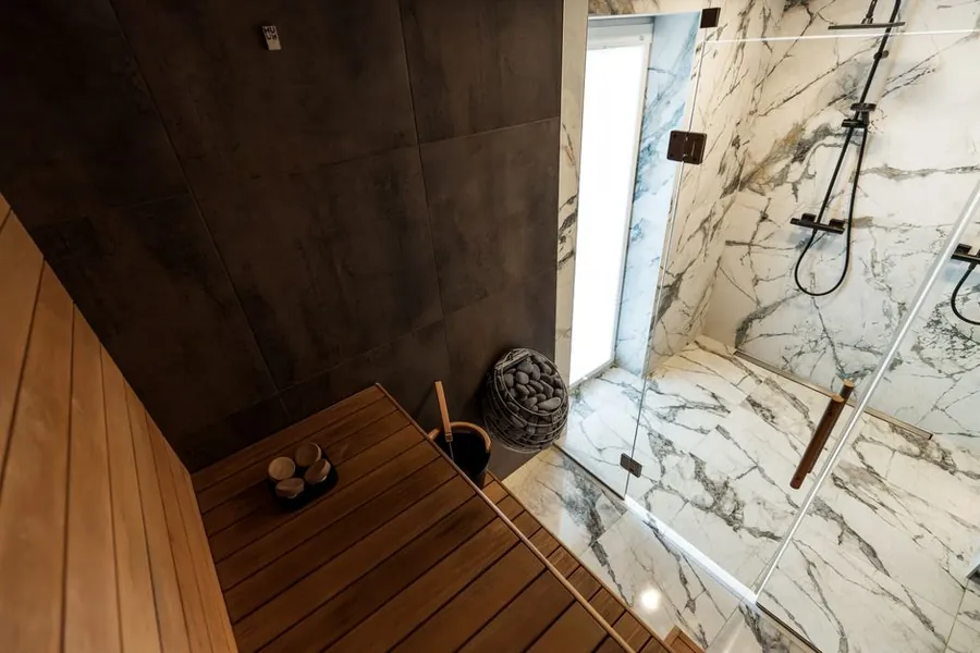 A tiled bench in a steam room of the type built into Exeter spa bathrooms