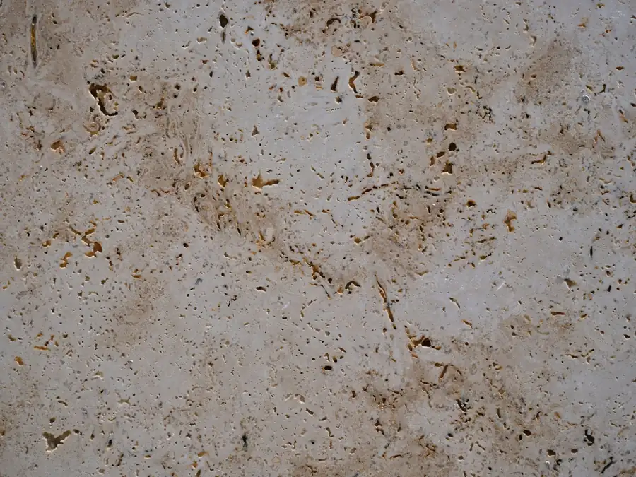The open pitted surface of travertine, the natural voids that have to be filled before it goes into a bathroom