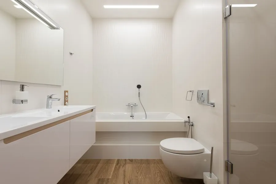 A bright modern bathroom with a wall-hung WC of the type fitted in Exeter homes