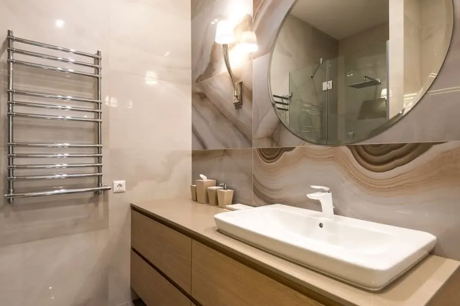 Onyx counter and oak vanity unit in a luxury Exeter bathroom