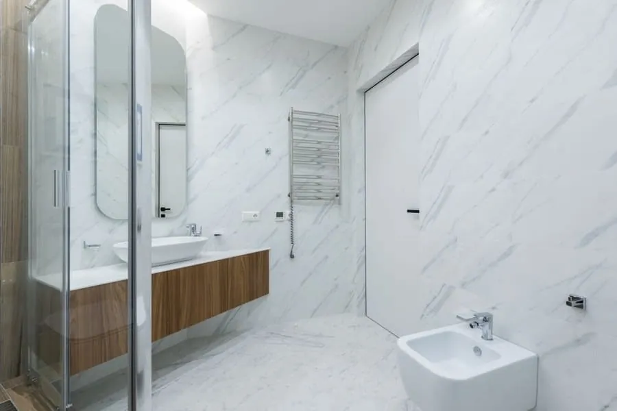 Marble-tiled bathroom with a freestanding bath in an Exeter property