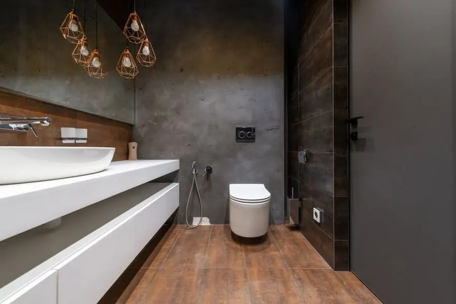 Long white vanity run with a vessel basin above an engineered wood floor in an Exeter bathroom