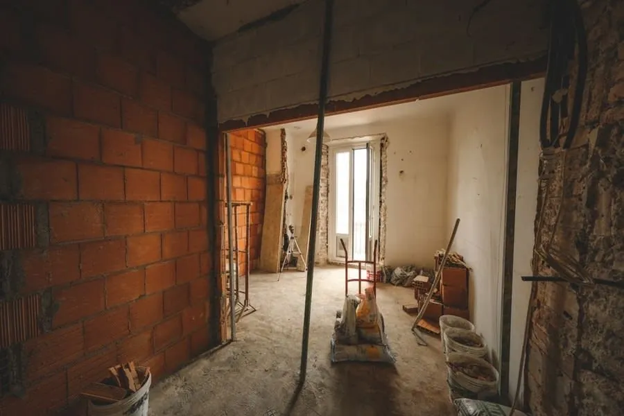 Room stripped back to brick and blockwork partway through a renovation