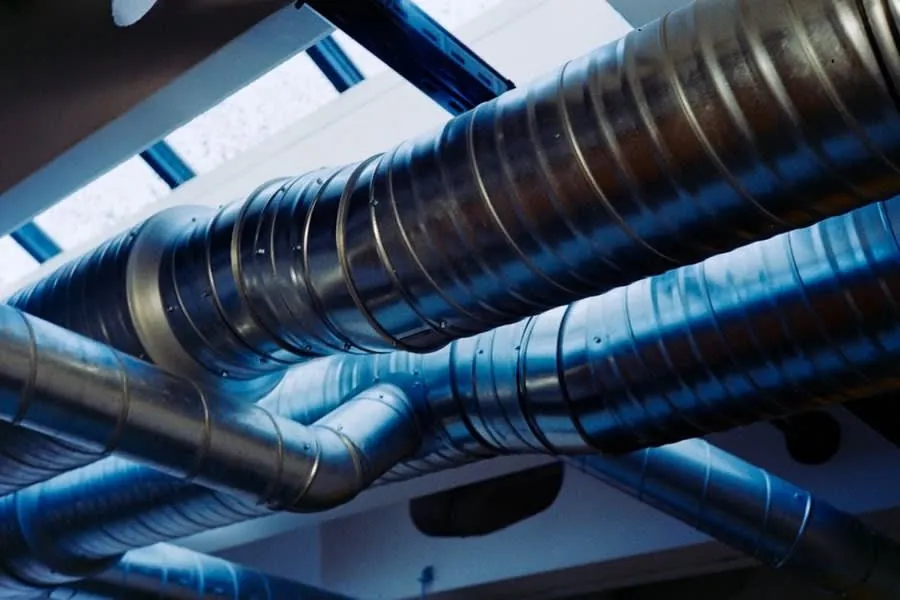 Spiral ventilation ducting of the kind used to run bathroom extract to outside air