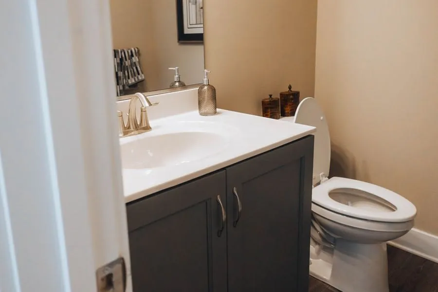 A compact WC and basin in a small cloakroom, showing how little floor area the room needs