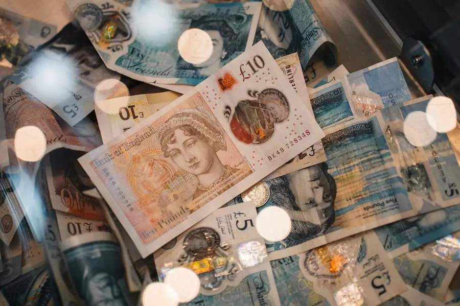 British five and ten pound notes and coins, the cash payment some traders push for