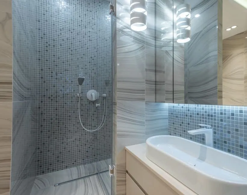 A newly finished bathroom with shower enclosure and basin, built to last