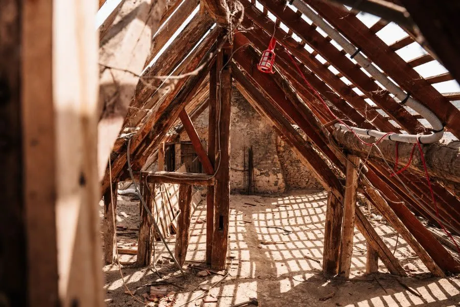 Rafters in a roof space, the route a relocated bathroom's extract duct normally takes