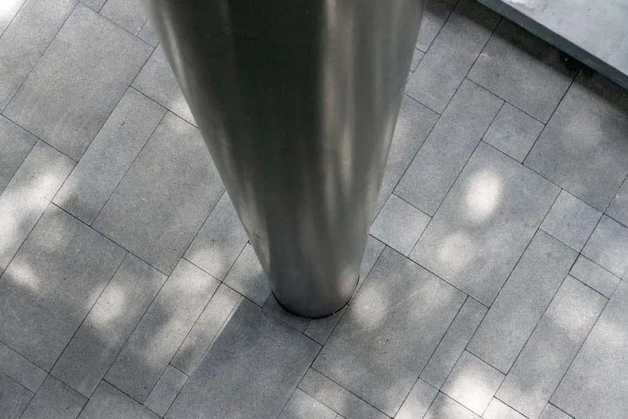 Large-format grey floor tiling, the finish laid over an underfloor heating build-up