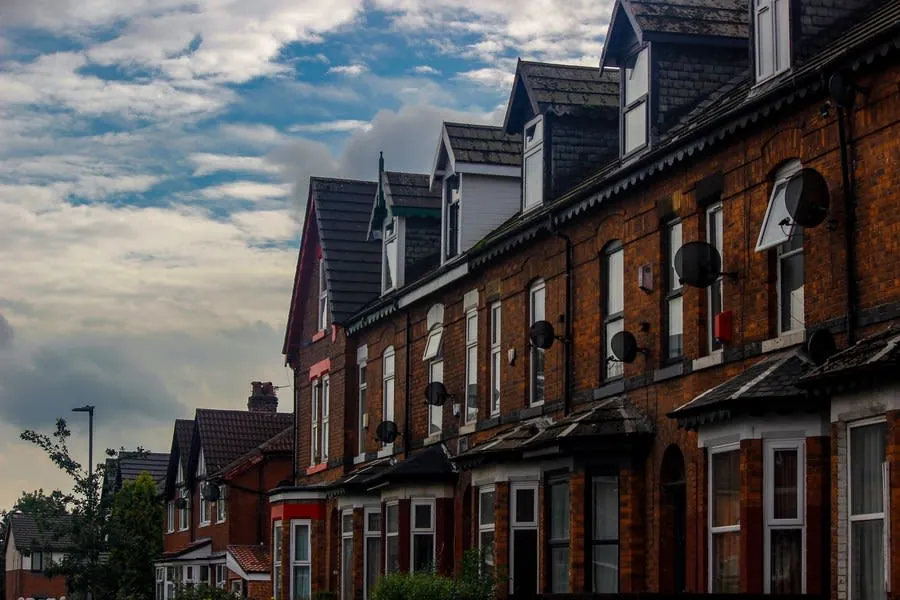 A row of brick terraced houses, the property type where moving a bathroom is most constrained