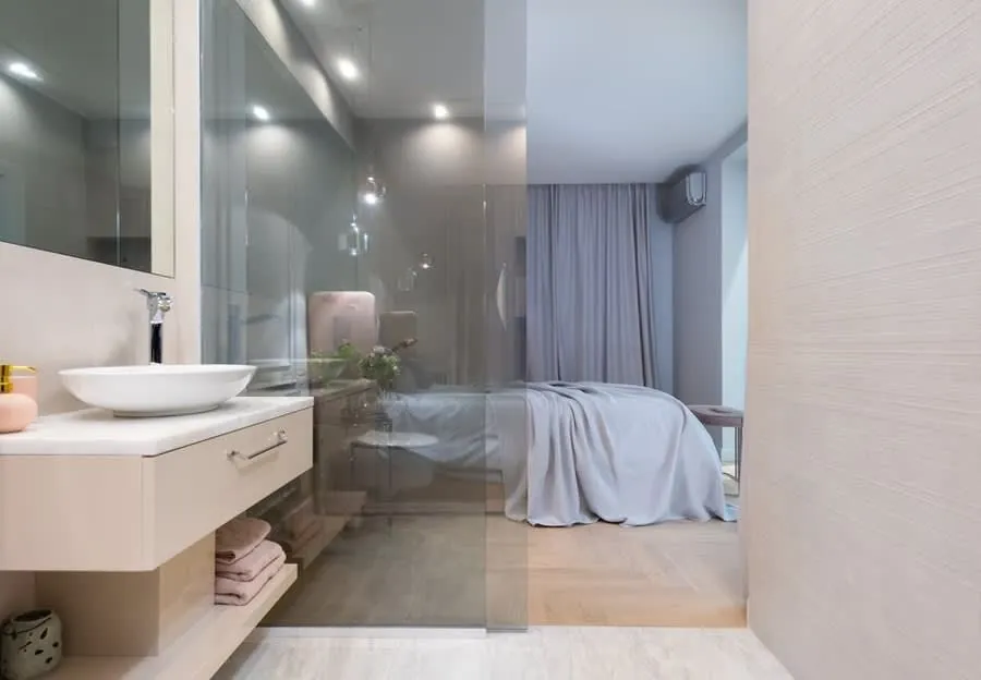 En-suite bathroom in Exeter separated from the bedroom by a glass partition